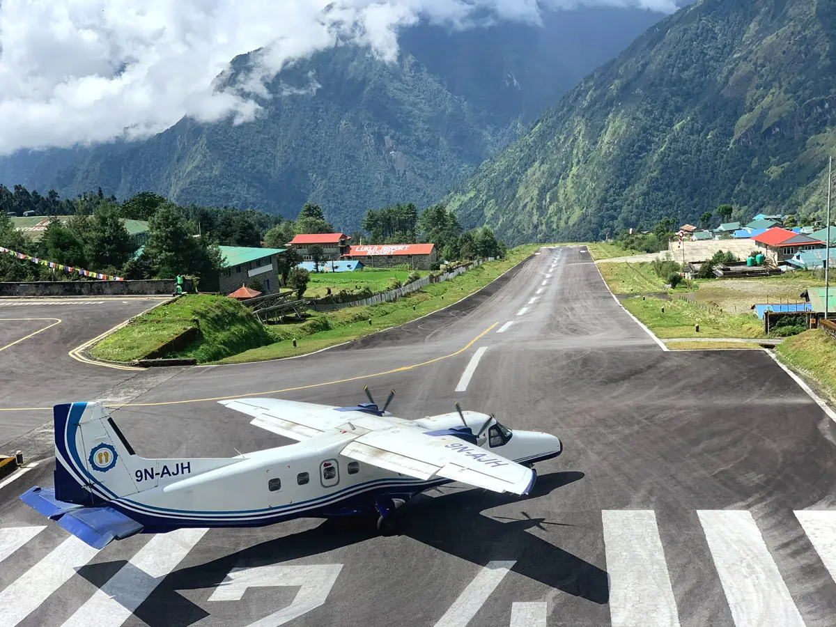 Lukla Airport runway with airplane