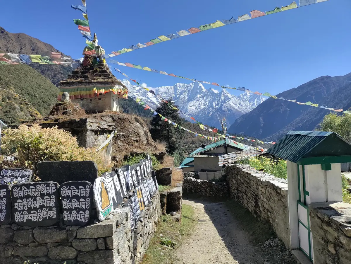 Thame village with mountains and prayer flags